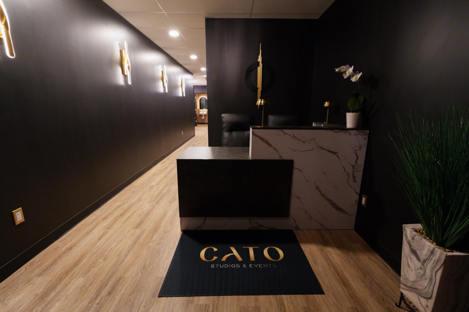 Cato’s welcoming entrance with black and gold details